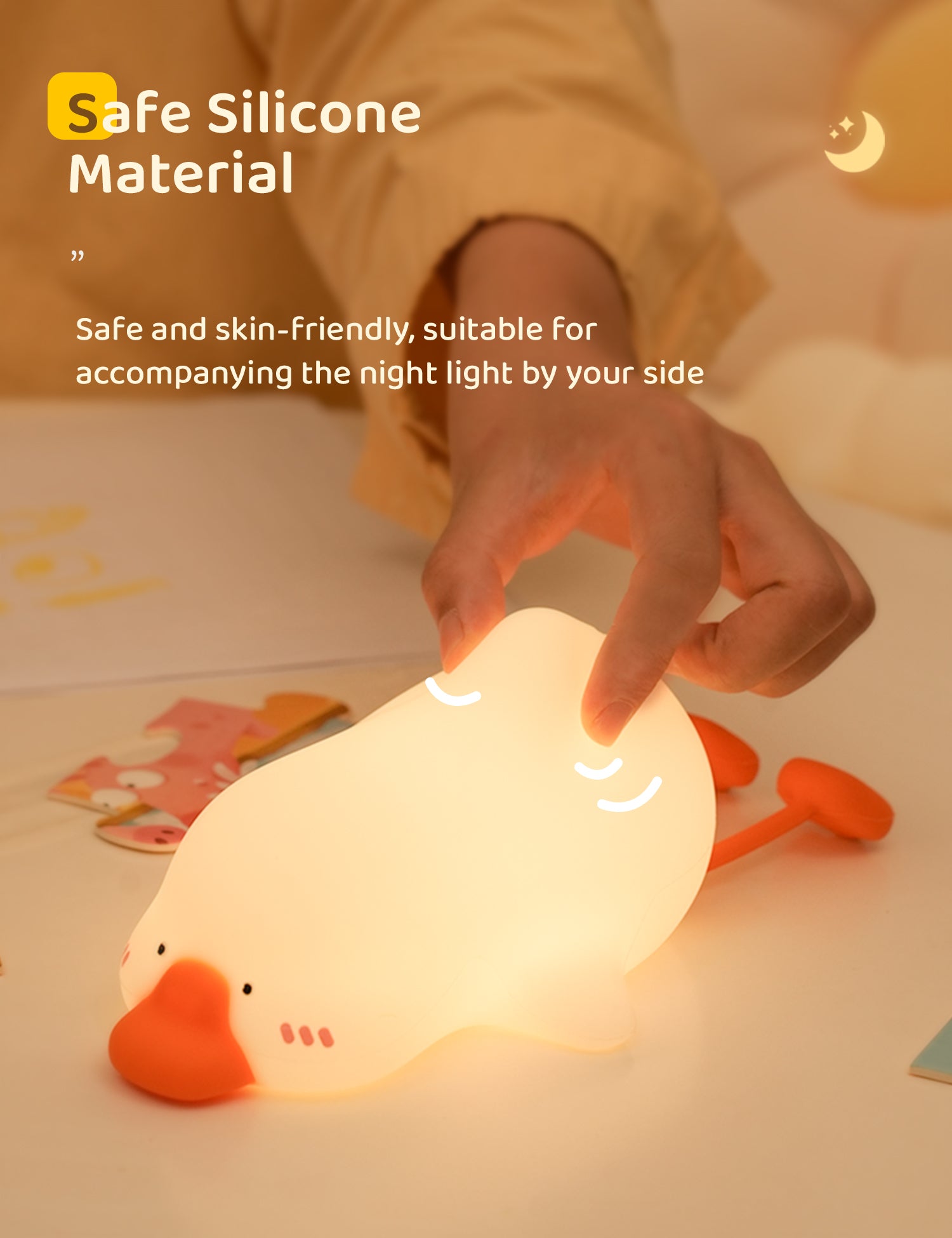Hand holding a duck-shaped night light with text about safe silicone material