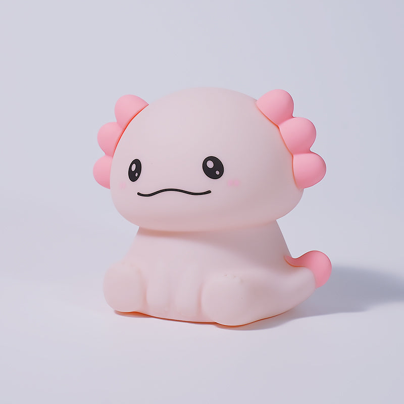 Pink axolotl plush toy on a light purple background