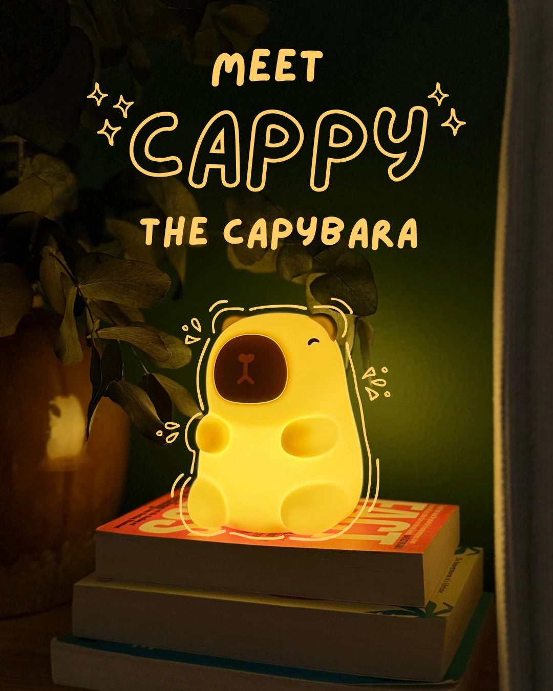 Glowing capybara-shaped night light on books with text 'Meet Cappy the Capybara' in a dark setting.