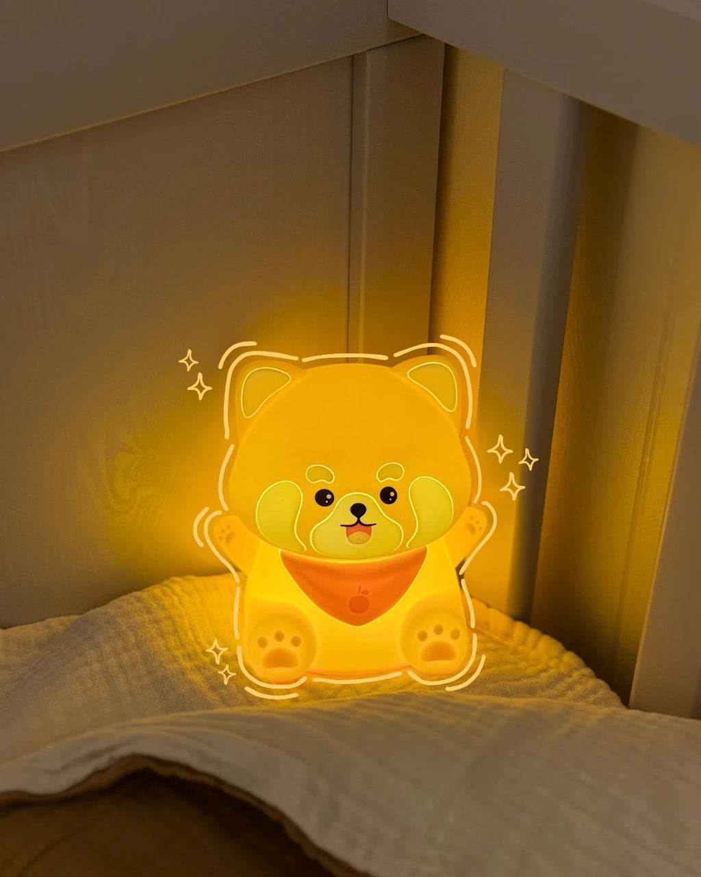 Red panda night light on a bed in a dimly lit room