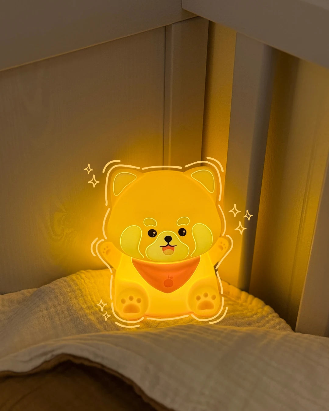 Red panda night light on a bed in a dimly lit room