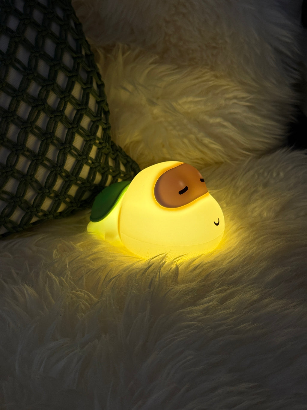 Light-up turtle toy on a fluffy white surface