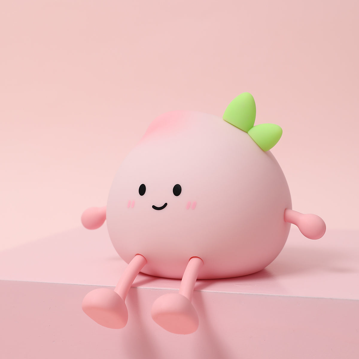 Cute, round character with a smiling face on a pink background